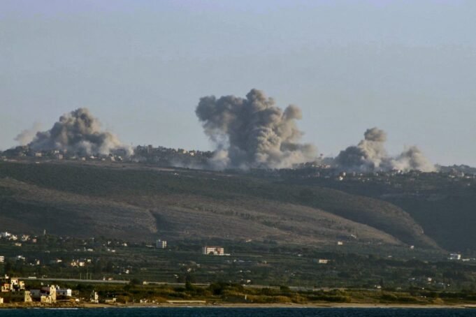 TOPSHOT - Smoke billows from the site of an Israeli air strike on the outskirts of the villages of Mansouri and Majdelzoun in the Tyre region in southern Lebanon on October 4, 2024. The Israeli army on October 4 said its forces had hit more than 2,000 sites during its four-day incursion into southern Lebanon targeting Hezbollah positions. (Photo by Kawnat HAJU / AFP) (Photo by KAWNAT HAJU/AFP via Getty Images)