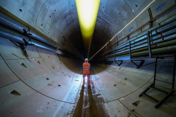 WATER ORTON, ENGLAND - SEPTEMBER 17: Mining engineers pose as they inspect the progress of the Mary Ann tunnel boring machine (TBM) in the HS2 Bromford Tunnel on September 17, 2024 in Water Orton, England. The construction of the Bromford tunnel, HS2's gateway to Birmingham, has reached the halfway point with the 1,600 tonne TBM, named 'Mary Ann' excavating 1.75 miles of the first bore of the 3.5 mile tunnel. (Photo by Christopher Furlong/Getty Images)