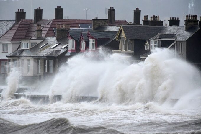 PRESTWICK, UNITED KINGDOM - DECEMBER 10: Waves crash against the promenade wall on December 10, 2014 in Prestwick, Scotland. High winds and large waves hit the North West Coast of the UK and Northern Ireland today. (Photo by Jeff J Mitchell/Getty Images)